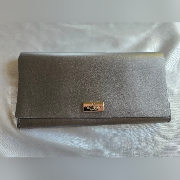 kate spade Handbags - Kate Spade Metallic Gray Wallet